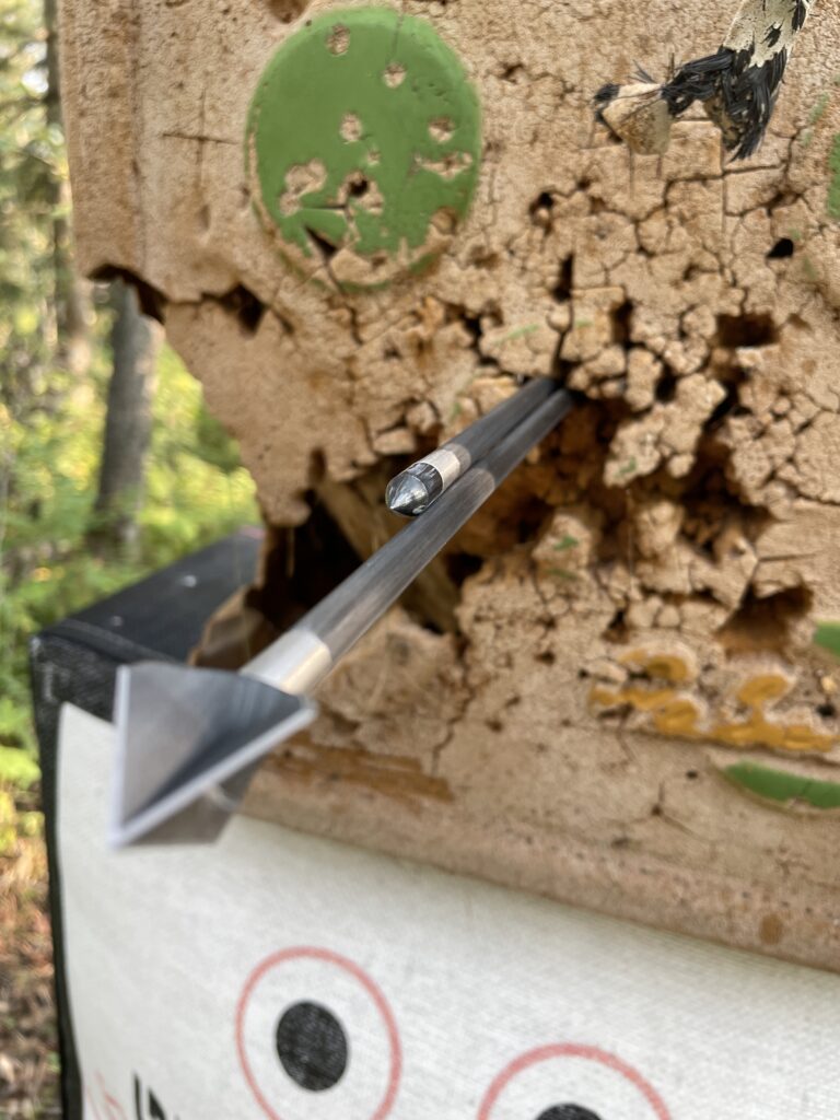 a broadhead grouping perfectly with a field tip during a preseason bowhunting checklist tuning session